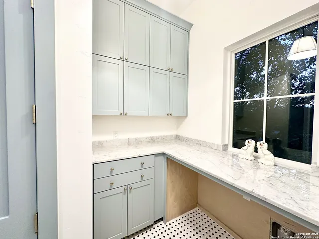 a kitchen with a sink and cabinets
