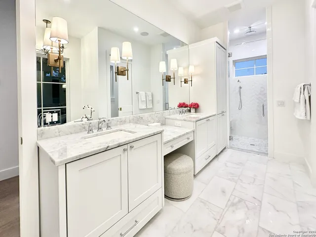 a kitchen with a sink appliances and cabinets