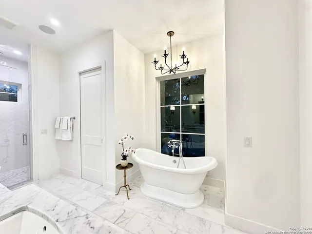 a bathroom with a toilet and shower