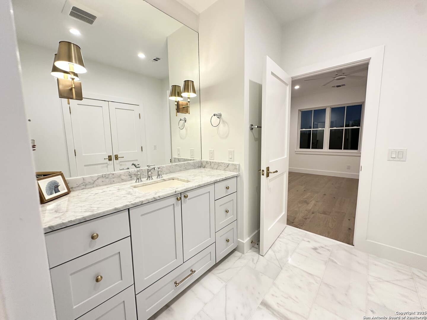 508 Lake Street Kingsland, TX 78639 - Photo 24 of 30 a bathroom with a granite countertop sink mirror and