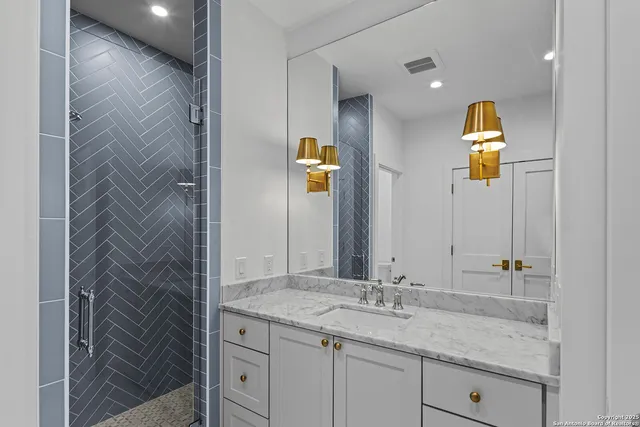 a bathroom with a sink and a mirror