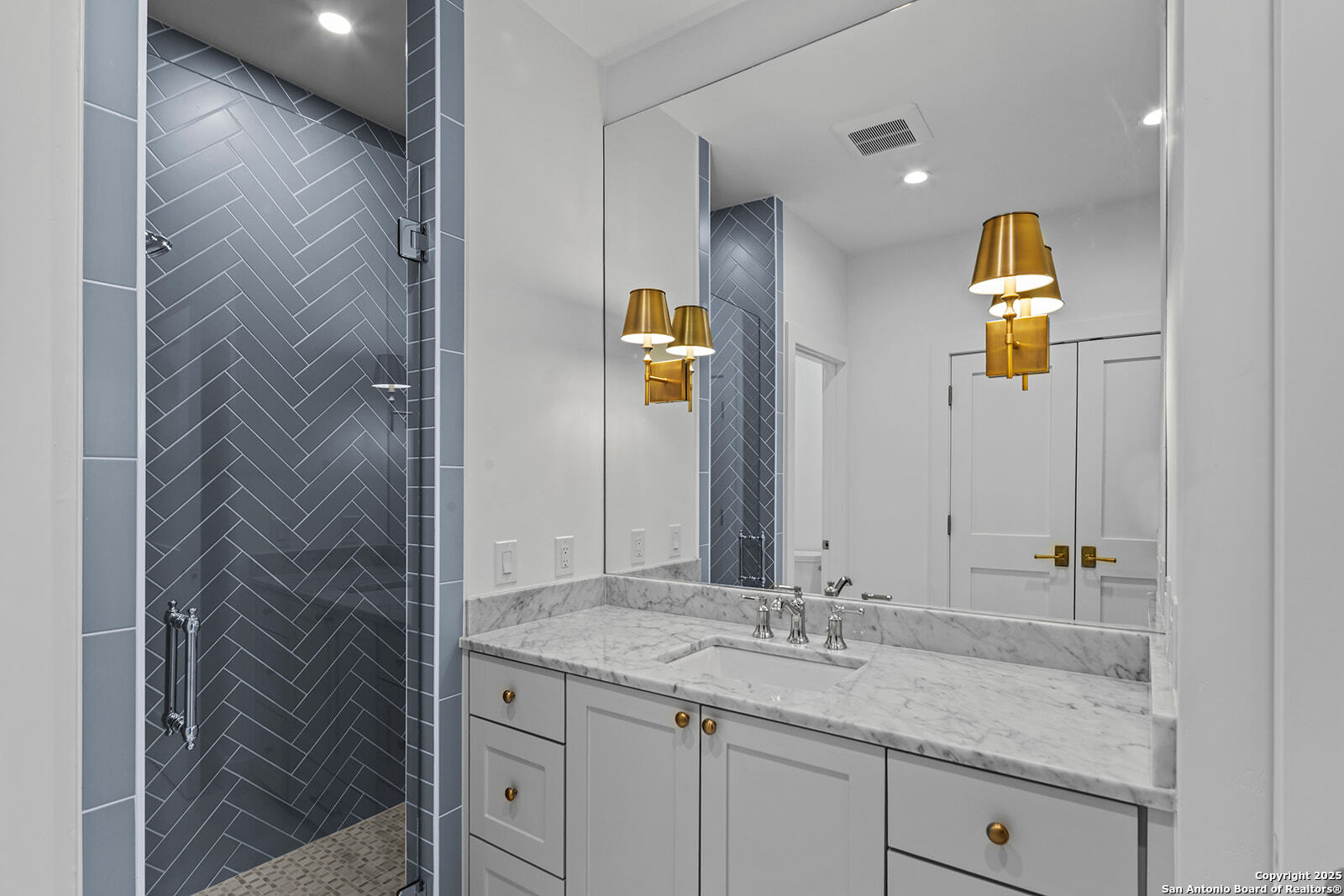 508 Lake Street Kingsland, TX 78639 - Photo 25 of 30 a bathroom with a sink and a mirror