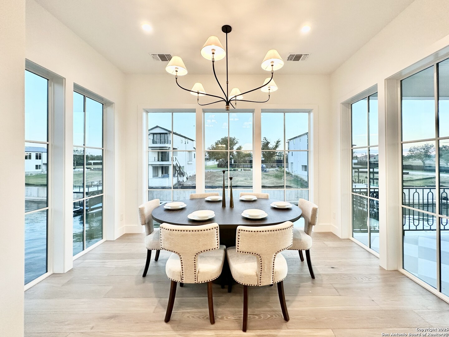 508 Lake Street Kingsland, TX 78639 - Photo 6 of 30 a view of a dining room with furniture wooden floor and chandelier