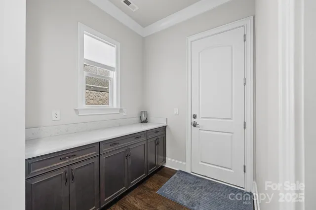 a view of a kitchen with cabinets