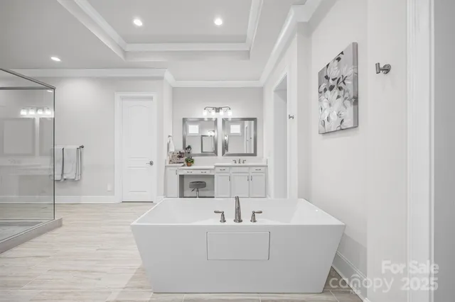 a living room with furniture and view of kitchen