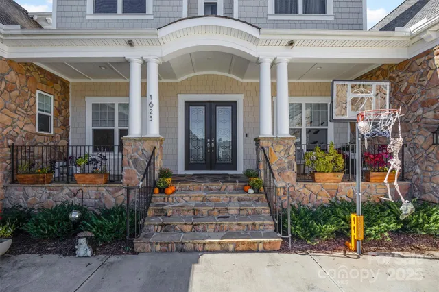 a front view of a house with outdoor seating