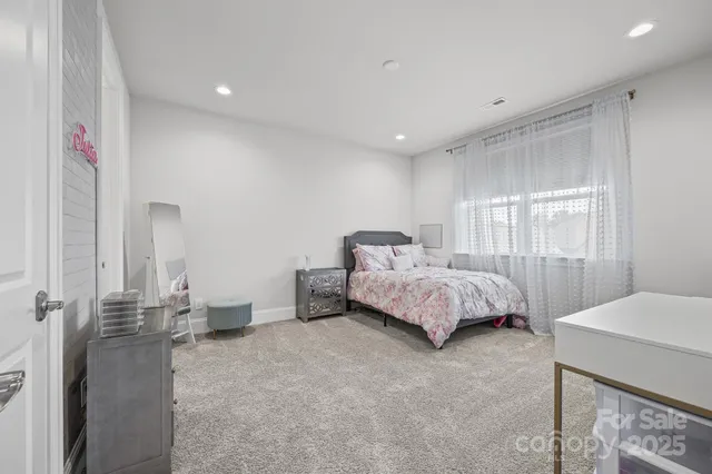 a bedroom with a bed and a table