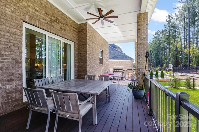 a view of outdoor space with deck and yard