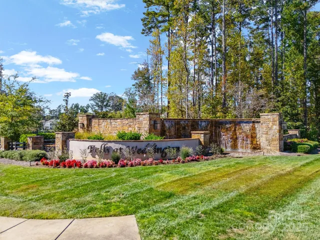 an aerial view of a house with outdoor space
