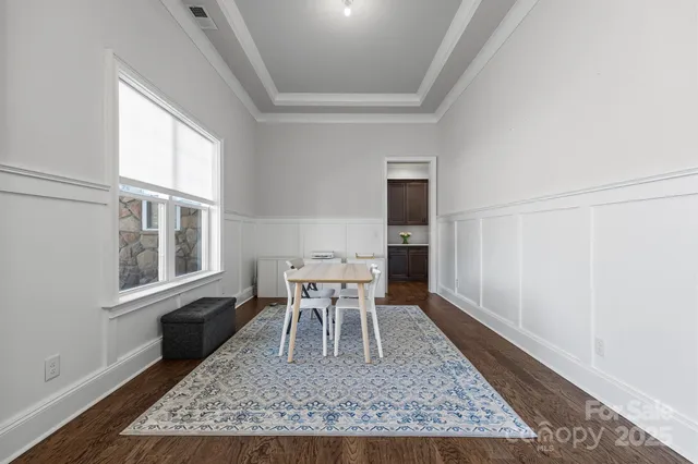 wooden floor in a livingroom with a rug