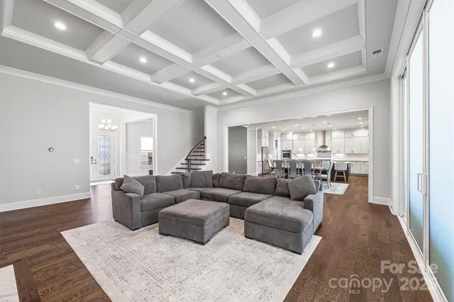a living room with furniture and a rug