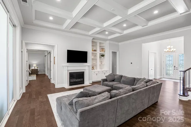 a living room with furniture fireplace and a flat screen tv