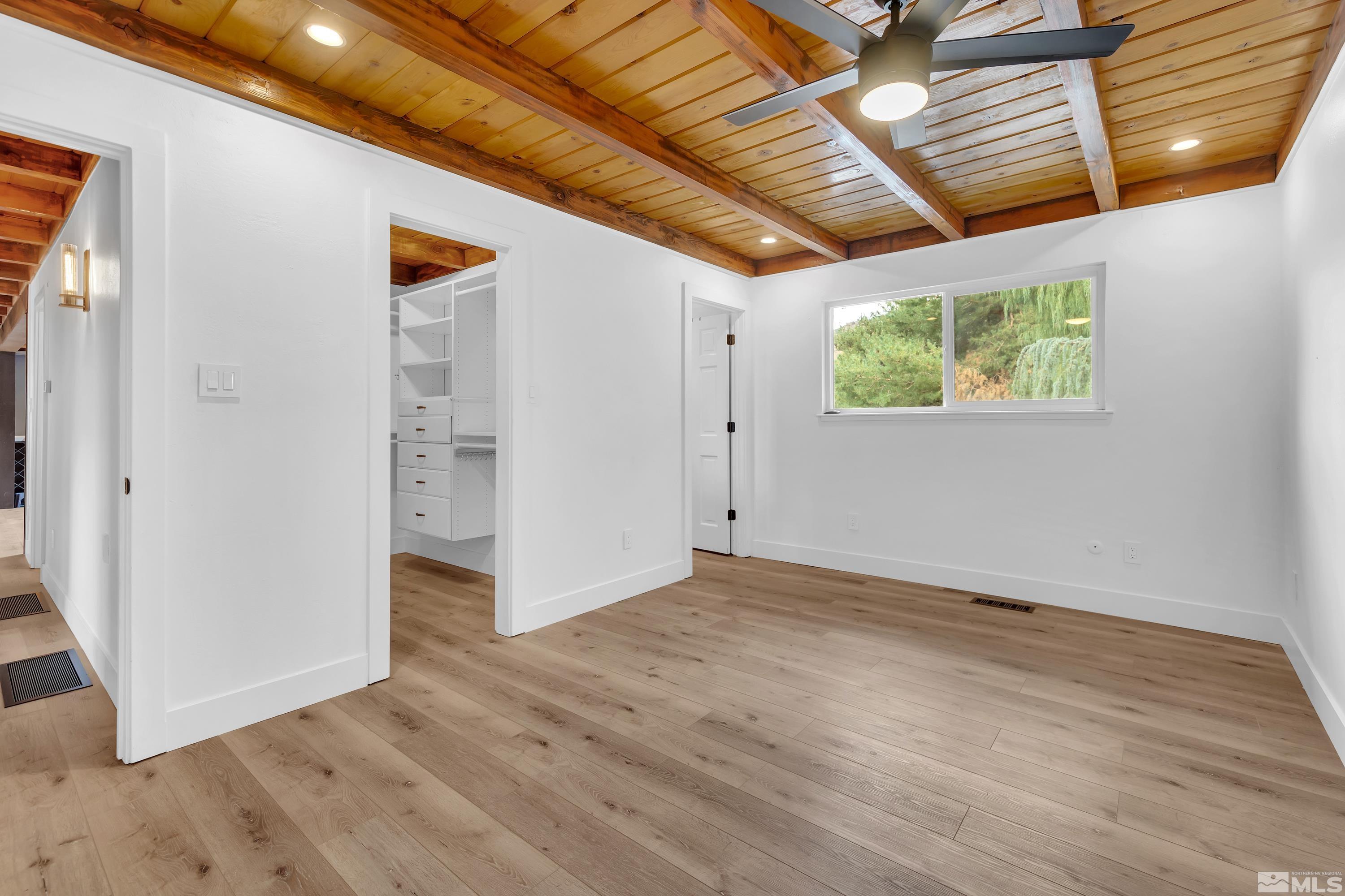 13750 Rancheros Drive Reno, NV 89521 - Photo 21 of 39 a view of hallway with wooden floor