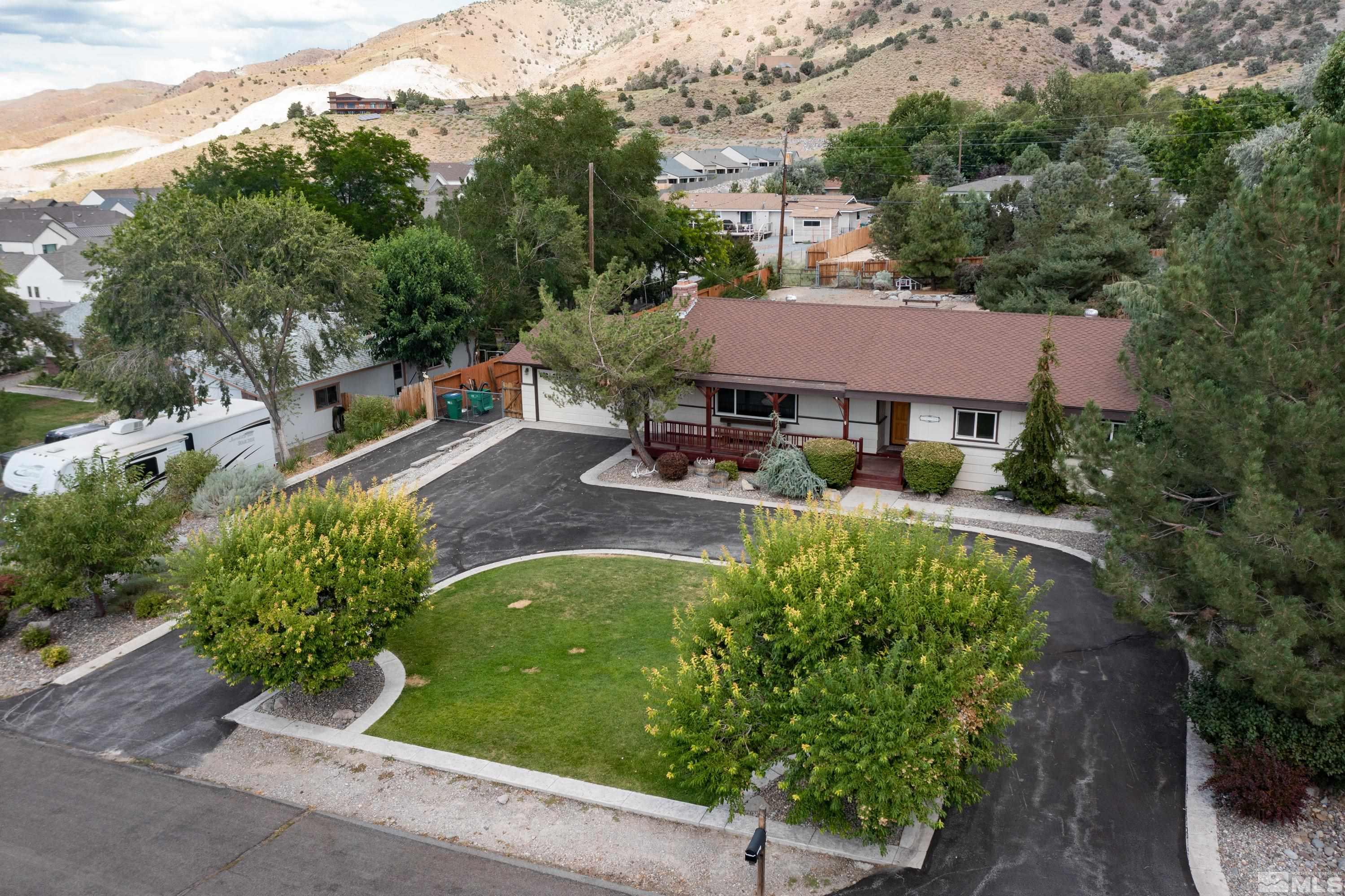 13750 Rancheros Drive Reno, NV 89521 - Photo 3 of 39 an aerial view of a house with garden space and sitting area