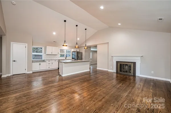 a view of kitchen with cabinets and wooden floor