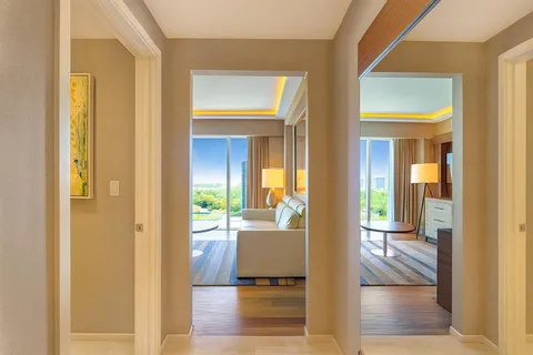 a view of a hallway with a sink and a bath tub