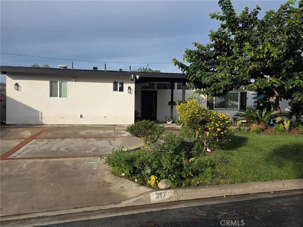 front view of a house with a yard