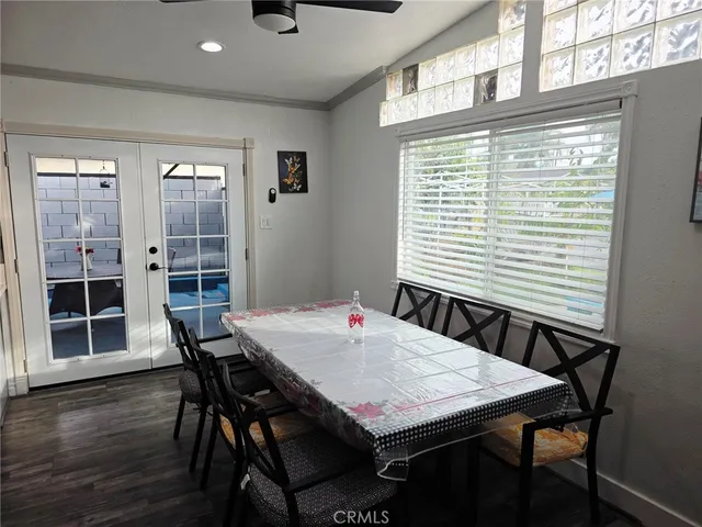 a dining room with a table chairs and wooden floor