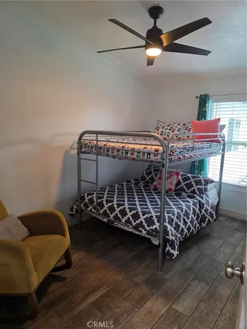 a bed room with furniture and a chandelier