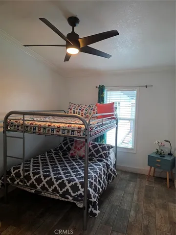 a bed room with a bed and a window