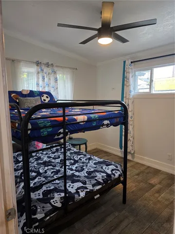 a bed room with a bed and a chandelier