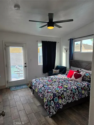 a bedroom with bed and window