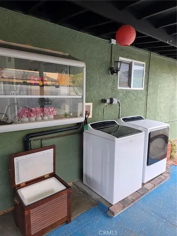 a living room with washer and dryer