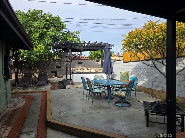 a view of a tables and chairs in a patio