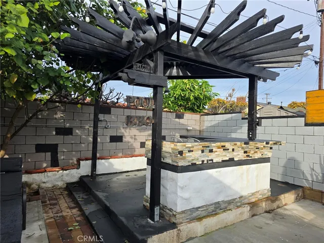 a view of a chairs and table in a patio