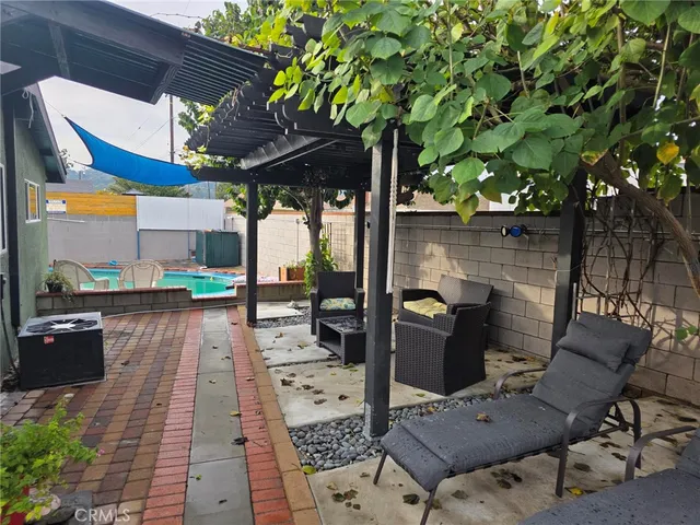 swimming pool view with a outdoor seating space