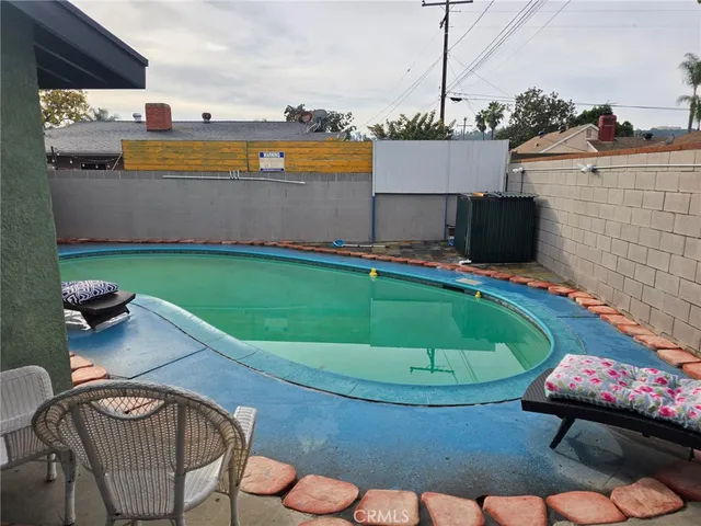 a view of a swimming pool with a patio