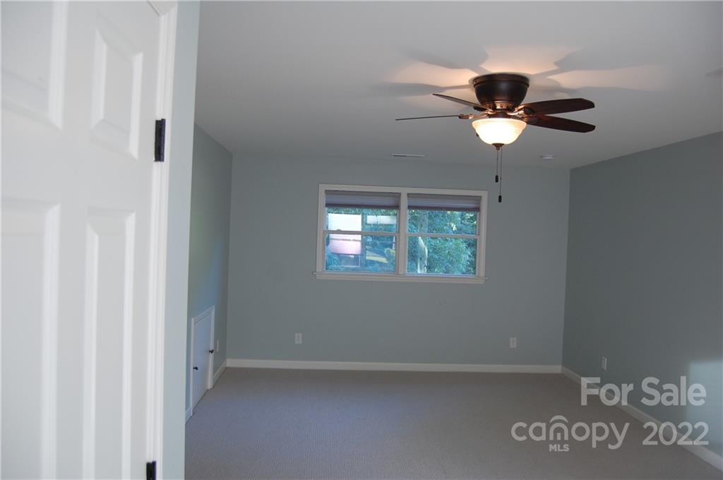 3101 Colony Road Charlotte, NC 28211 - Photo 17 of 26 an empty room with a window and a fan