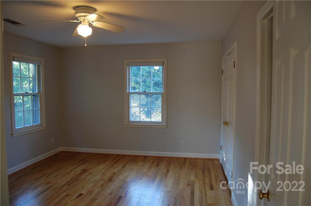 3101 Colony Road Charlotte, NC 28211 - Photo 21 of 26 a view of wooden floor and a chandelier fan in a room