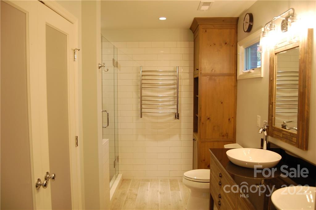 3101 Colony Road Charlotte, NC 28211 - Photo 26 of 26 a bathroom with a toilet a sink and shower
