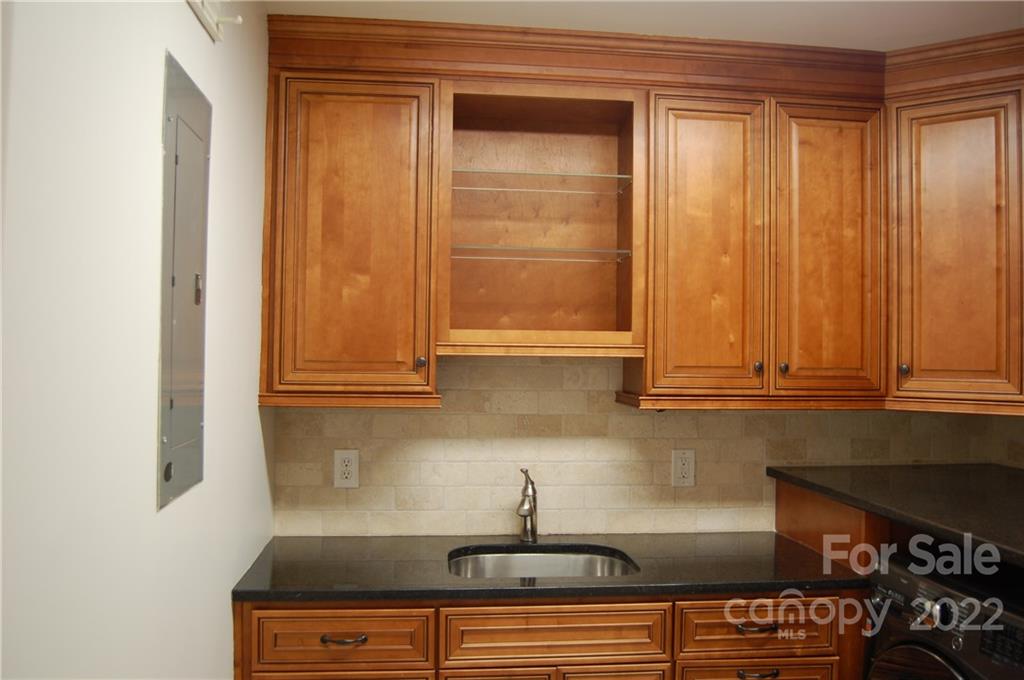 3101 Colony Road Charlotte, NC 28211 - Photo 9 of 26 a kitchen with a sink and cabinets