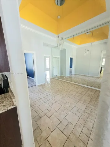 a view of a bathroom with a sink and a mirror