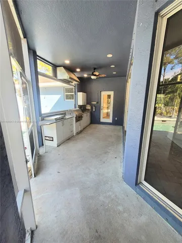 a view of a hallway with stairs