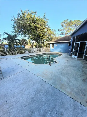 a view of backyard and tree