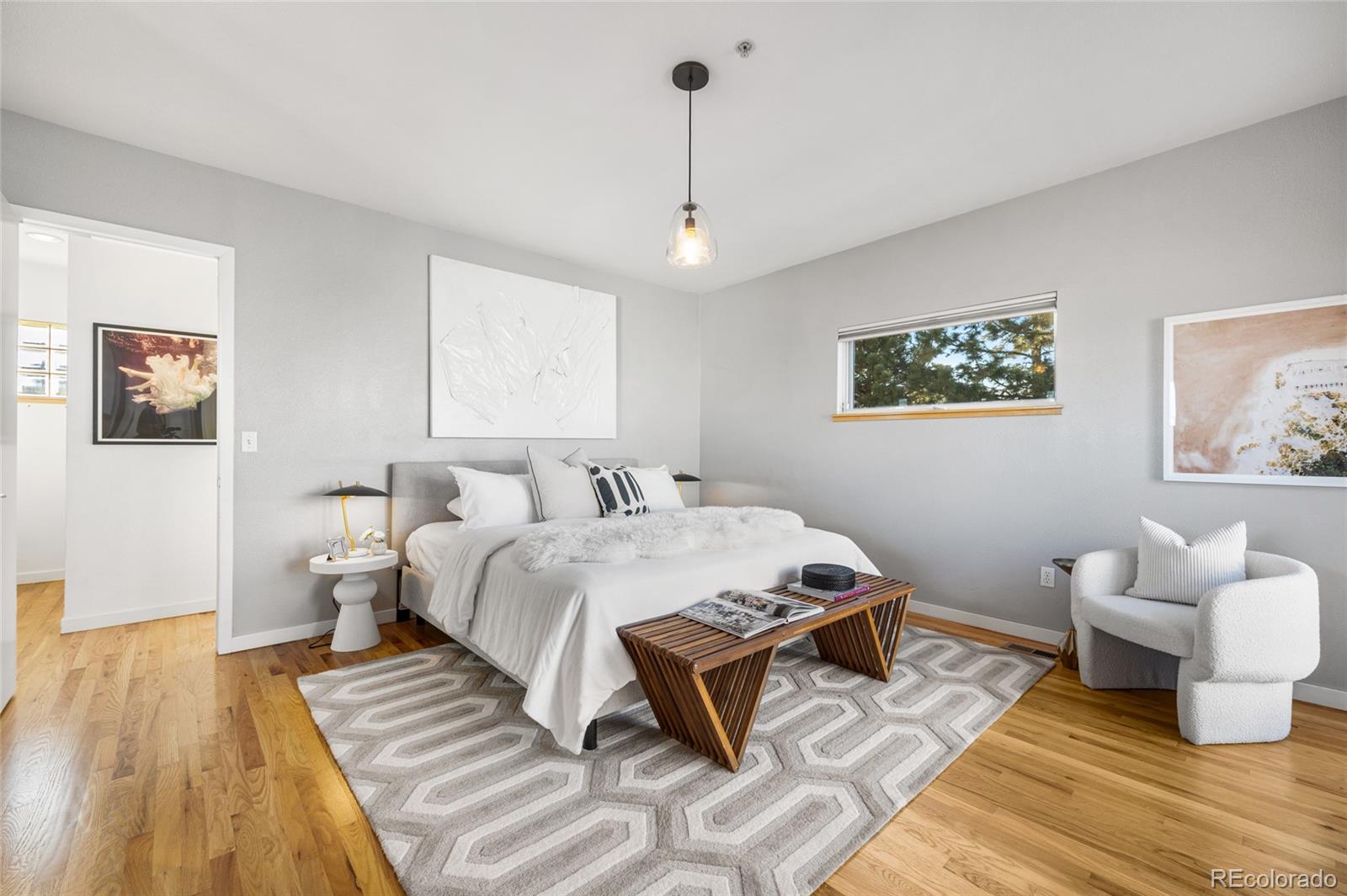 1675 Boulder Street Denver, CO 80211 - Photo 19 of 39 a bed room with a bed and a couch