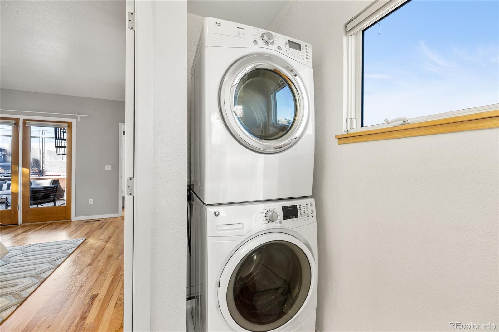 1675 Boulder Street Denver, CO 80211 - Photo 26 of 39 a view of a hallway with washer and dryer