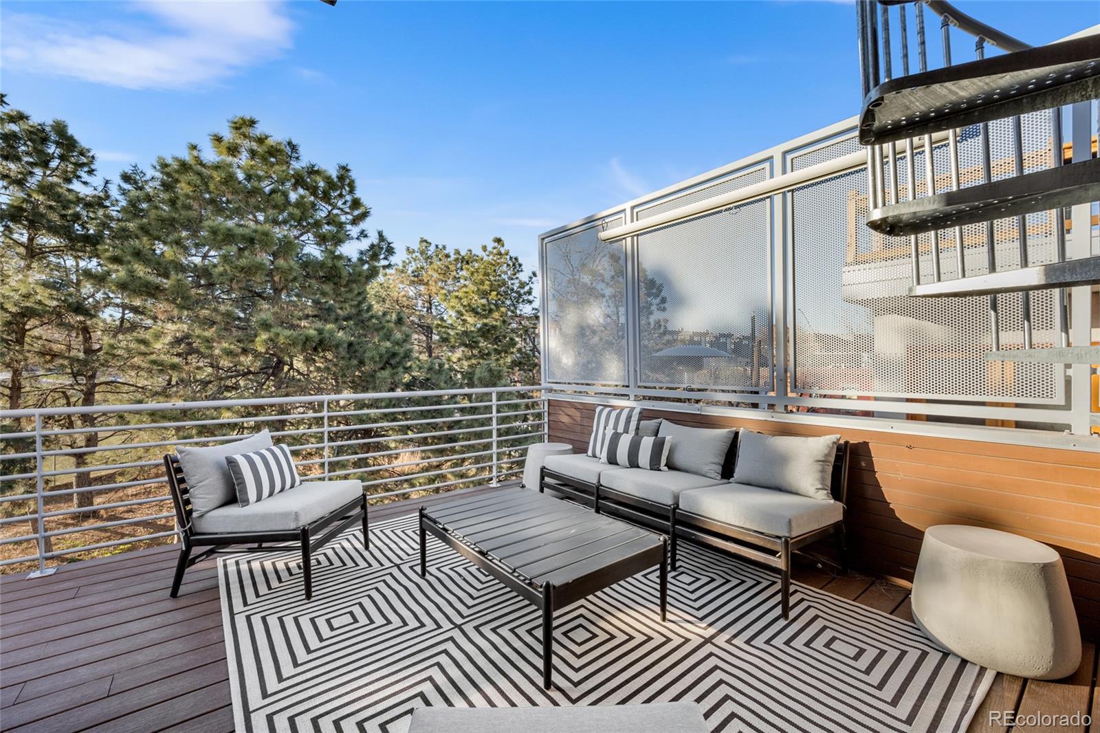 1675 Boulder Street Denver, CO 80211 - Photo 27 of 39 a balcony with wooden floor and outdoor seating