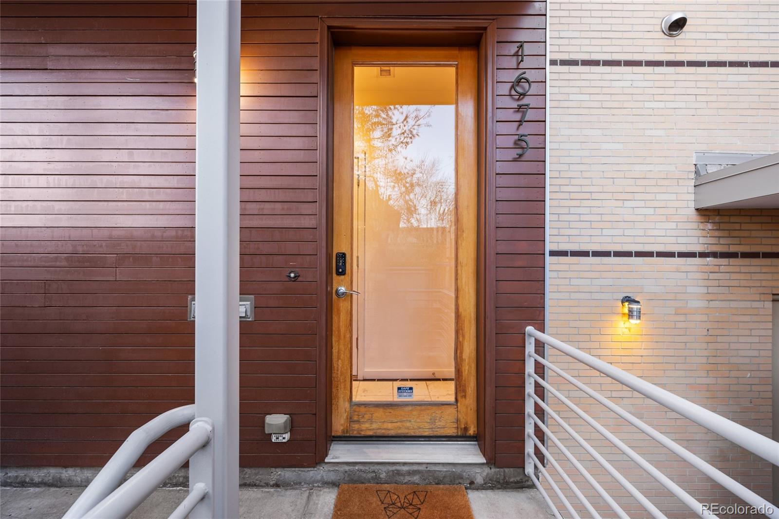 1675 Boulder Street Denver, CO 80211 - Photo 4 of 39 a view of a hallway with wooden floor and door