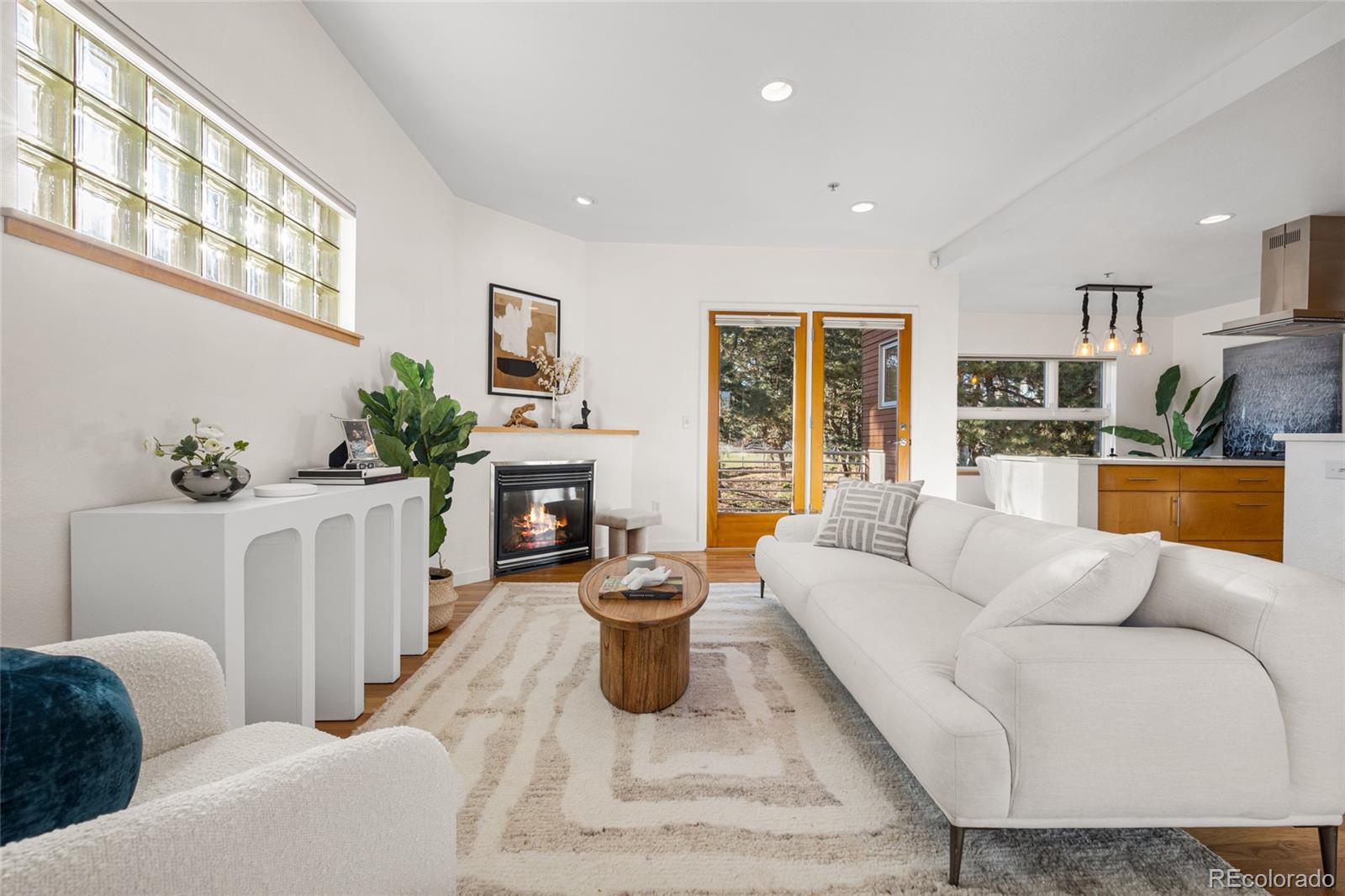 1675 Boulder Street Denver, CO 80211 - Photo 9 of 39 a living room with furniture a fireplace and a large window