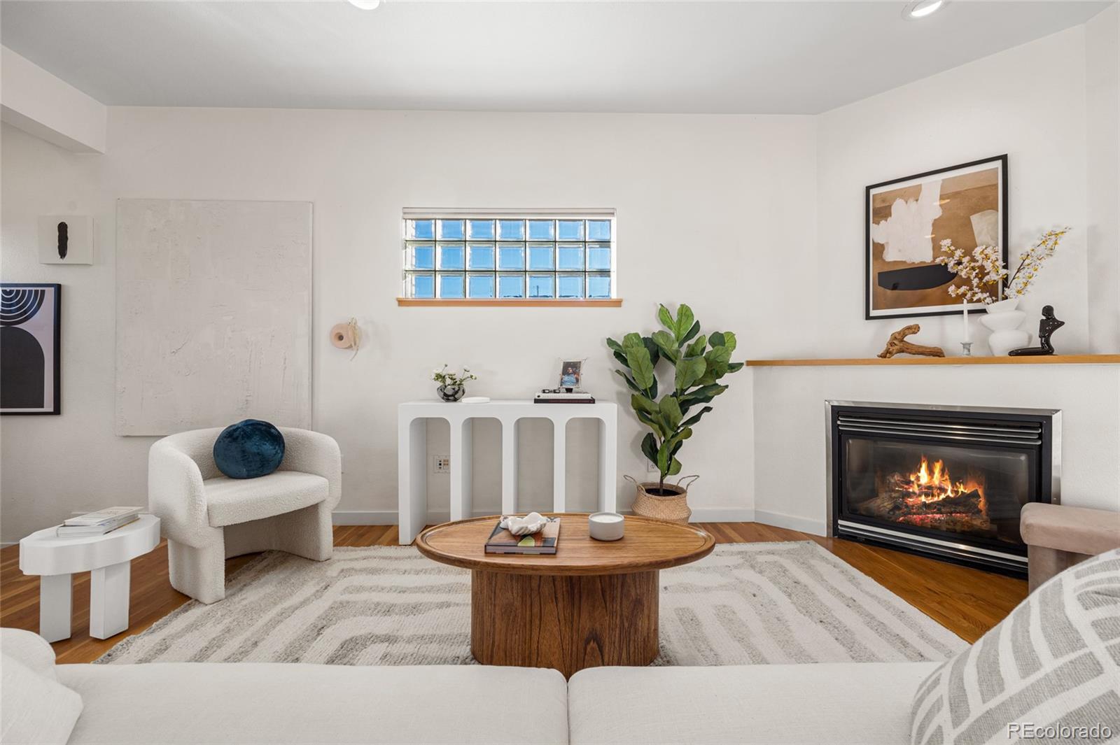1675 Boulder Street Denver, CO 80211 - Photo 10 of 39 a living room with furniture and a fireplace