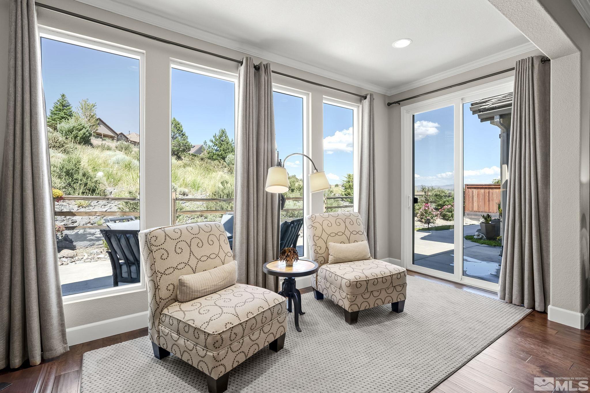 9092 Kenton Trail Reno, NV 89523 - Photo 22 of 34 a living room with furniture and a large window with outer view