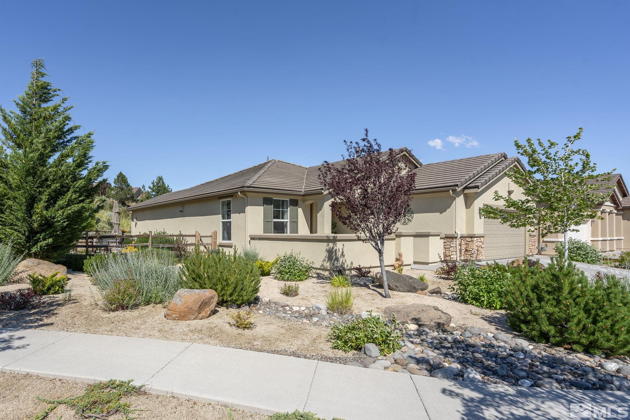 9092 Kenton Trail Reno, NV 89523 - Photo 25 of 34 a front view of a house with a yard