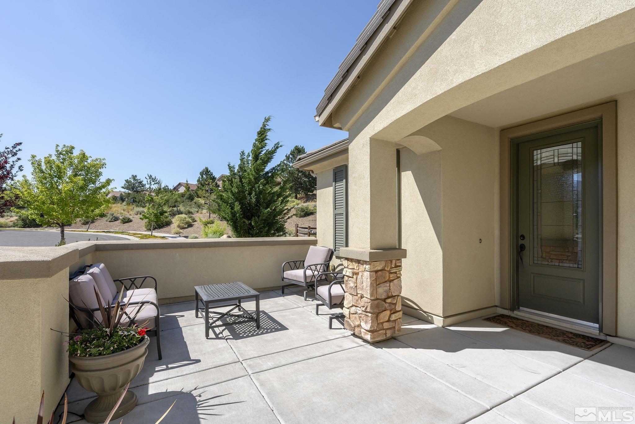 9092 Kenton Trail Reno, NV 89523 - Photo 4 of 34 a view of swimming pool with outdoor seating and plants
