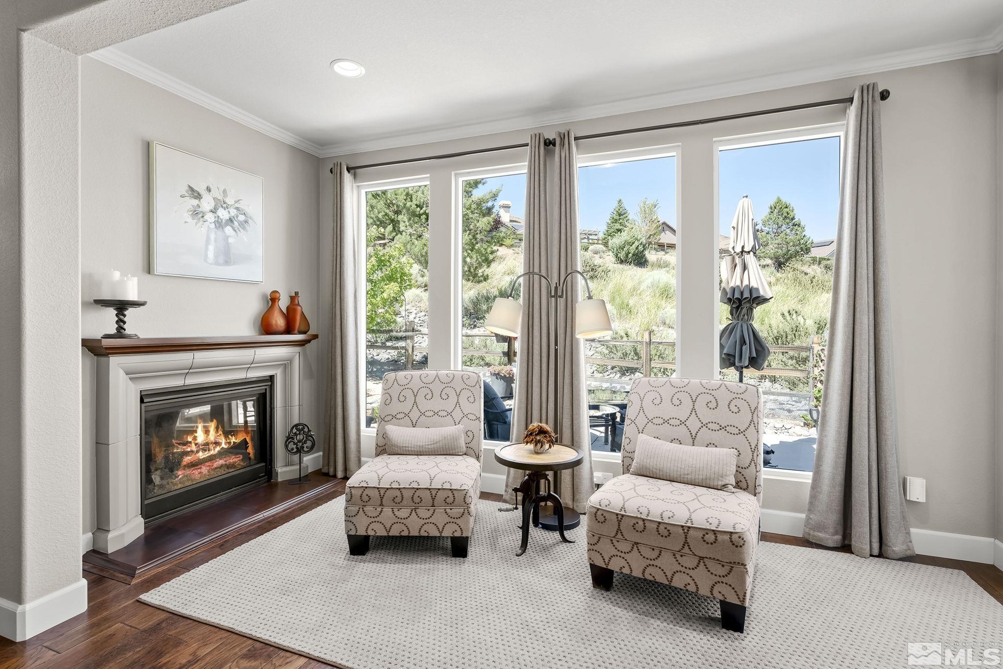 9092 Kenton Trail Reno, NV 89523 - Photo 10 of 34 a living room with furniture and a fireplace