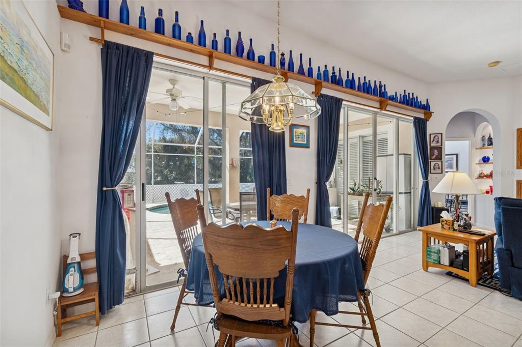 928 Oakview Road Tarpon Springs, FL 34689 - Photo 18 of 75 a view of a dining room with furniture and a large window