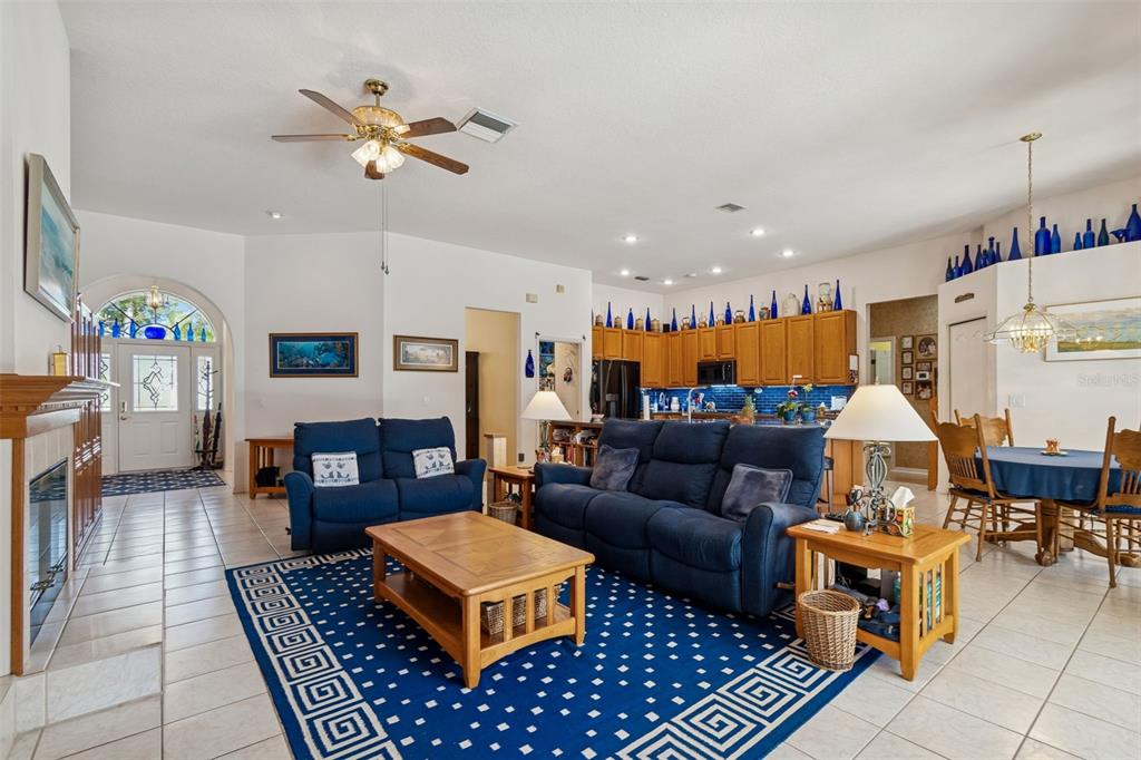928 Oakview Road Tarpon Springs, FL 34689 - Photo 19 of 75 a living room with furniture kitchen view and a table